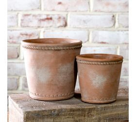 Terra cotta deco planter with a warm earthy finish and decorative detailing, perfect for succulents, faux plants, and rustic home decor