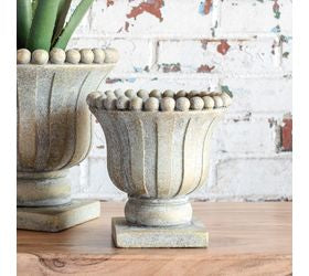 "7 inch decorative pot urn with an elegant classic silhouette, perfect for displaying faux florals, greenery, and sophisticated home decor accents
