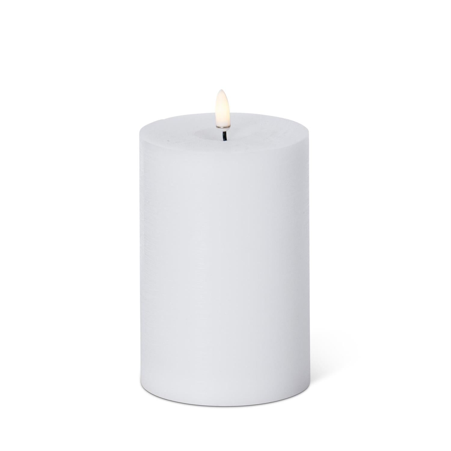 White touch LED pillar candle with timer, 6 by 4 inch size, featuring a realistic wax finish and warm flameless flickering light for safe and elegant home decor"