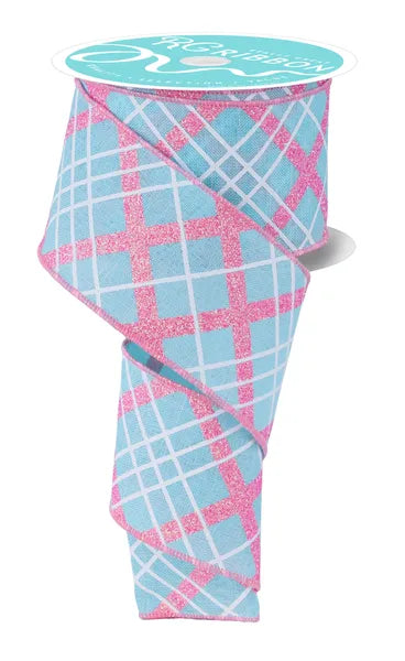 Folded fabric with blue and pink plaid pattern on a white background