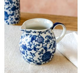 "7 inch blue floral squat pitcher with a charming hand-painted floral design, perfect for displaying faux stems, dried flowers, and farmhouse home decor"