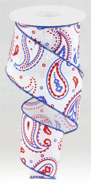 Paisley patterned ribbon in red, white, and blue on a white background