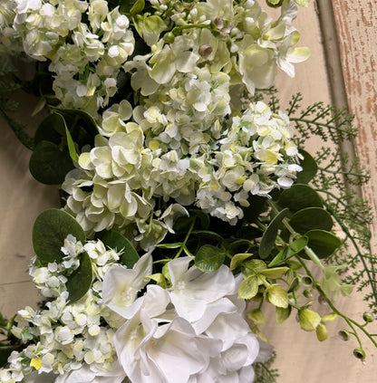Close-up of Lacey Grace hydrangea wreath showing delicate faux hydrangea bloom detail and layered greenery texture"