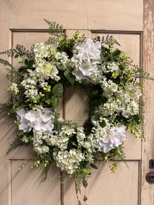 Lacey Grace hydrangea wreath with soft faux hydrangea blooms and lush greenery on a natural base, perfect for front doors and elegant year-round home decor"