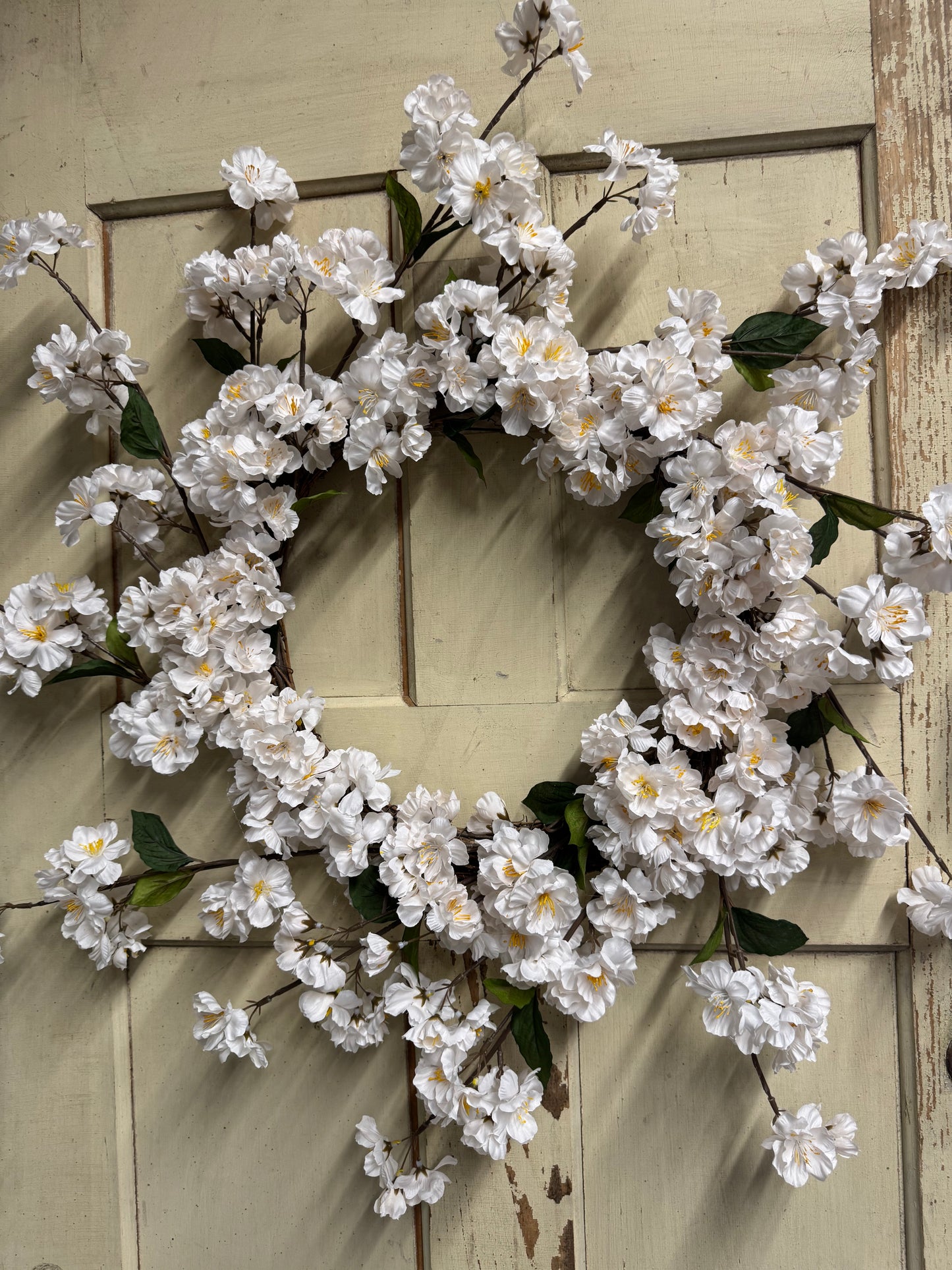 Lillian Blossom handcrafted wreath with soft faux blossoms and lush greenery, perfect for front doors and elegant year-round home decor"