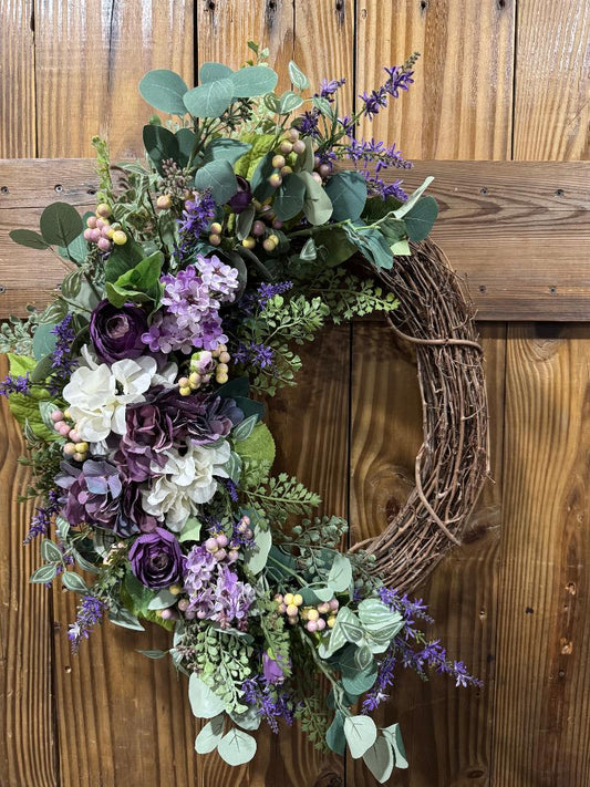 Violet Grace handmade purple floral wreath by Carolyn at The Wreath Room. Premium faux florals and greenery on a grapevine base.