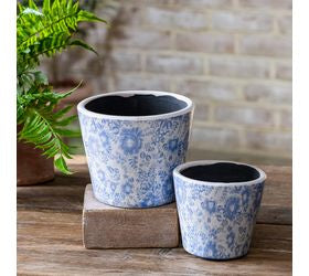 Medium blue floral garden pots with a charming painted floral design, perfect for succulents, faux plants, and cottage-style home decor"
