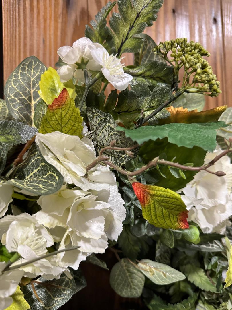 Handmade full green and white hydrangea wreath with ferns and eucalyptus on grapevine base by Carolyn.