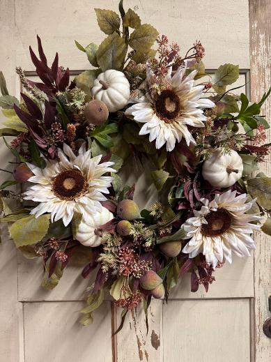 Handcrafted fall wreath with cream sunflowers, ivory pumpkins, flocked pears & burgundy foliage on a 14" grapevine base. Approx. 22" tip to tip.