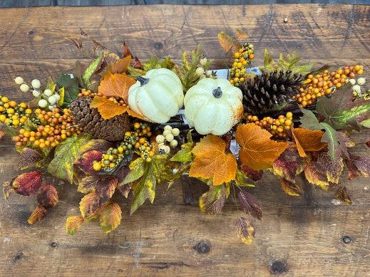 Juliette faux fall centerpiece with white pumpkins, orange and cream berries, pinecones, and autumn foliage in burnt orange, burgundy, and gold on a whitewashed wooden tray