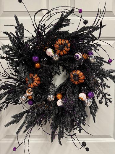 24-inch black Halloween wreath with eyeballs and orange glitter pumpkins
