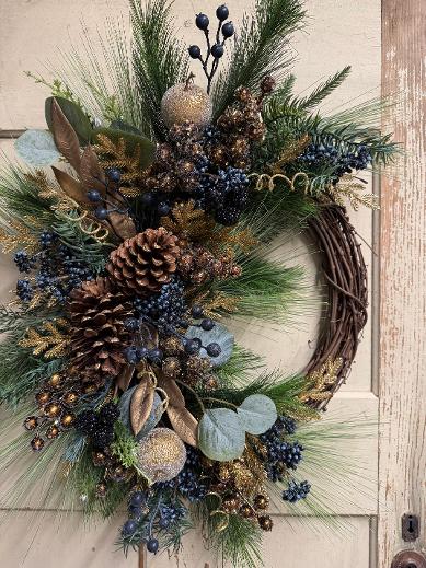 Merry Winterberry grapevine Christmas wreath with green pine, eucalyptus, cream beaded apples, blue berries, pinecones, and gold accents.”