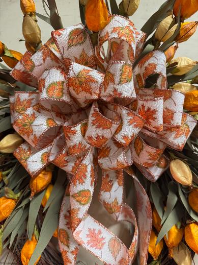 Goldie Glitter Harvest is a handcrafted fall wreath with Chinese lanterns, glitter bow & ribbon on a grapevine base. Made by hand in NH