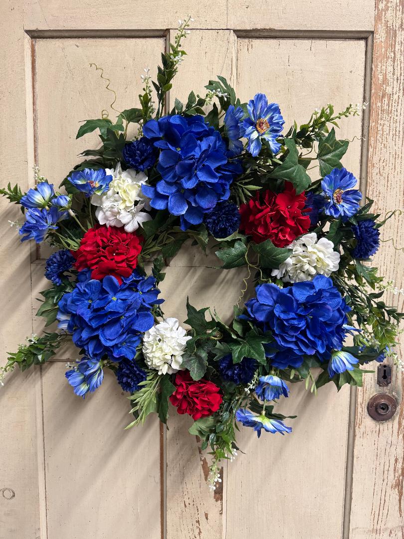 24 inch Susie Belle patriotic wreath with red, white, and blue hydrangea blooms and lush greenery, perfect for front doors and Fourth of July home decor"