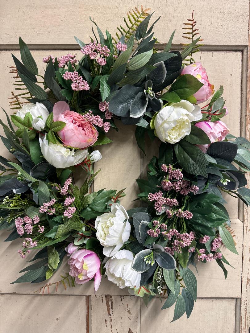 Pink and white peony wreath with lush faux pink and white peony blooms and green foliage on a natural base, perfect for front doors and romantic home decor"