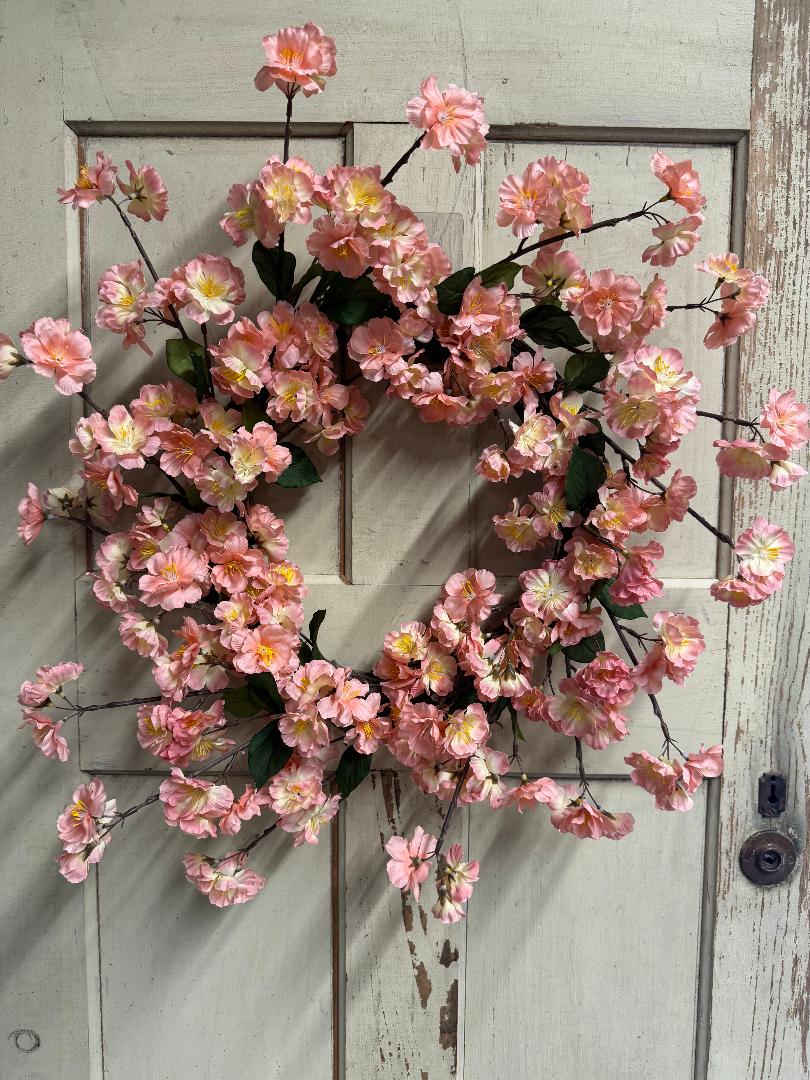 Marlowe Blossom handcrafted wreath with soft faux blossoms and lush greenery on a natural base, perfect for front doors and elegant year-round home decor"